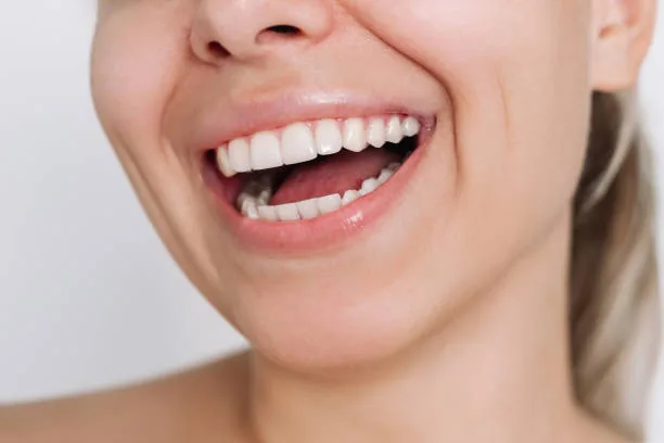 close-up shot of a woman's smile
