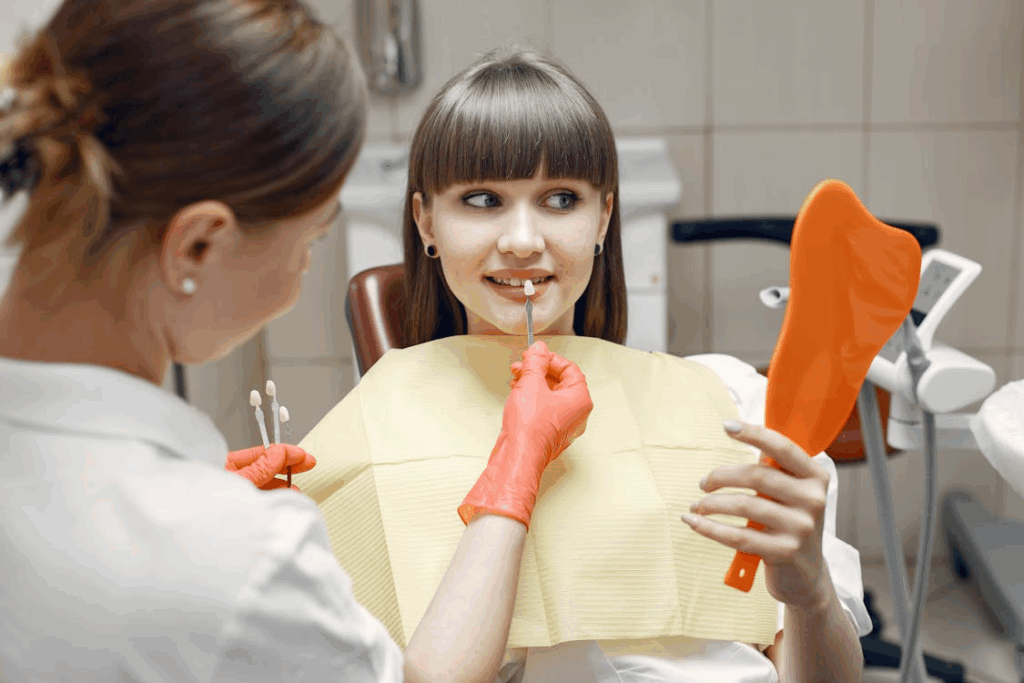a woman choosing her veneers color