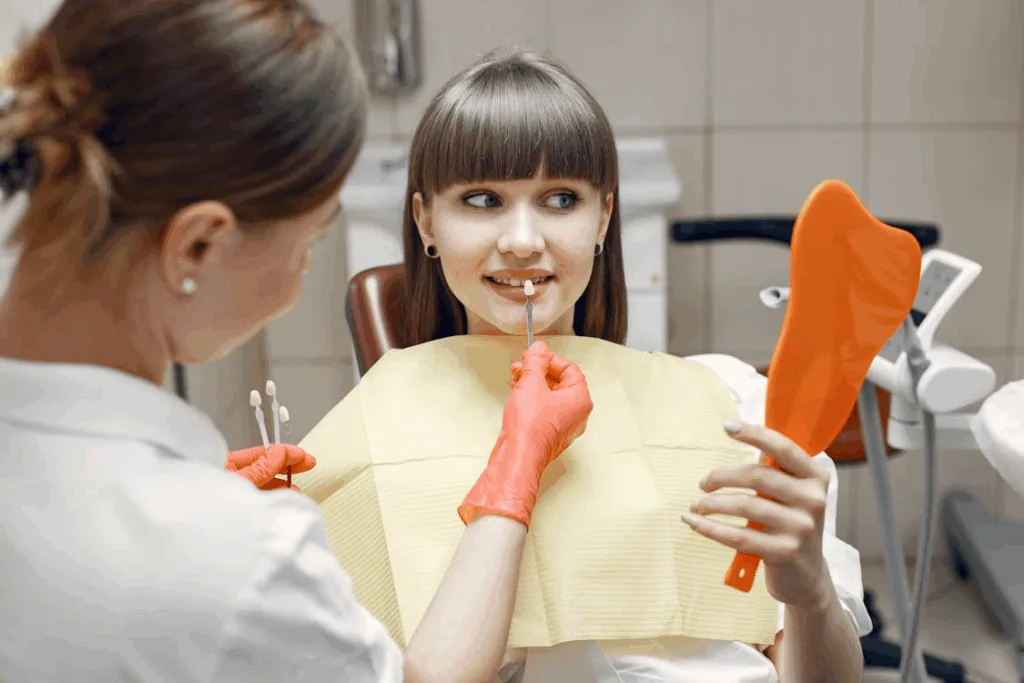 a woman choosing her veneers color