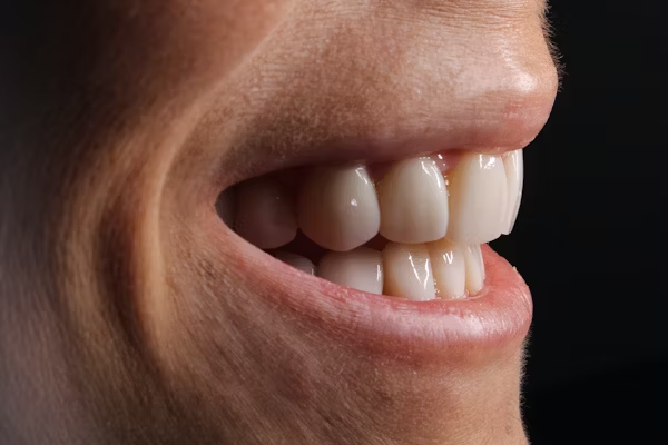 side view shot of a person's smile