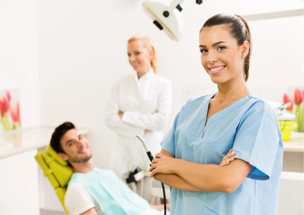 Cosmetic dentist consulting with a patient about whether veneers can close tooth gaps and improve smile appearance.