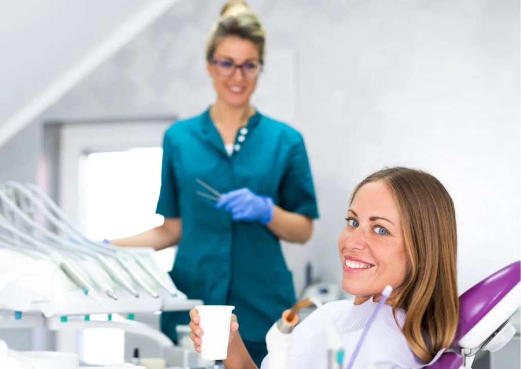 Patient discussing cosmetic treatment options with a dentist to determine whether veneers can fix crooked teeth.